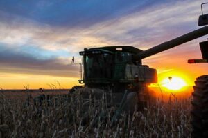 Some of the best sunsets in God's paintbrush can be seen from the field! Our combine is silhouetted against a vibrant fall sky.
