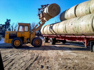 Our payloader is great for loading and unloading bales of hay and corn stover from the semi trailer.