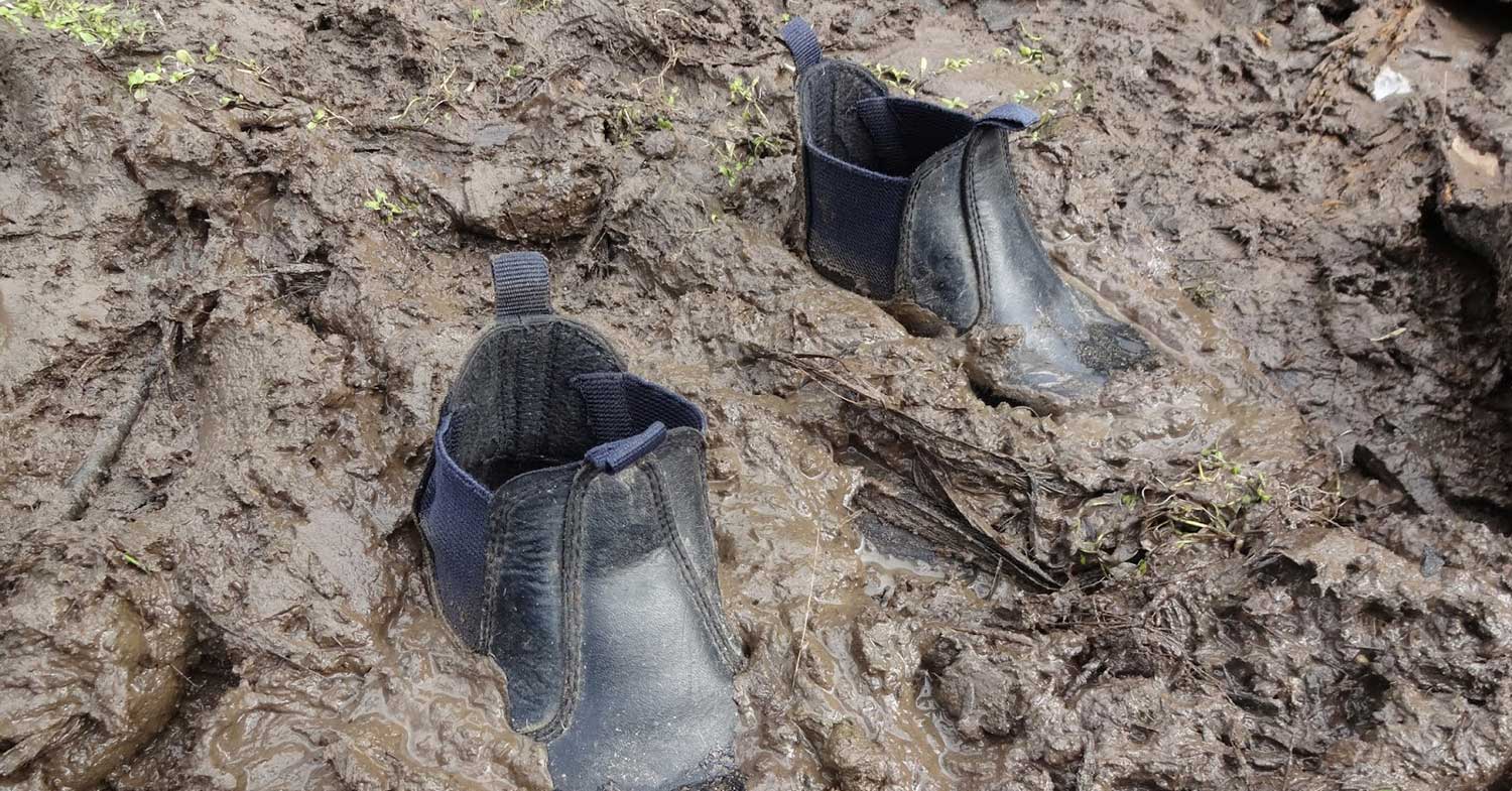 Boots stuck in mud - God will help pull us out of muck and mire we get ourselves into - no matter how deep or helpless it may seem.