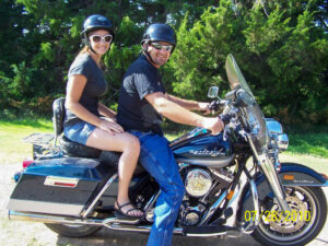 Phil and his youngest daughter, Angela, take a ride on the Harley.