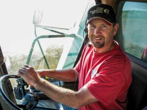 Phil spends many hours each summer and fall in the seat of a combine, bringing in the fruits of another season's labor.