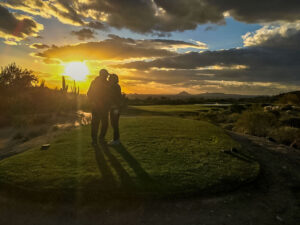 Phil and Janice enjoy a beautiful sunset while on a golf outing.
